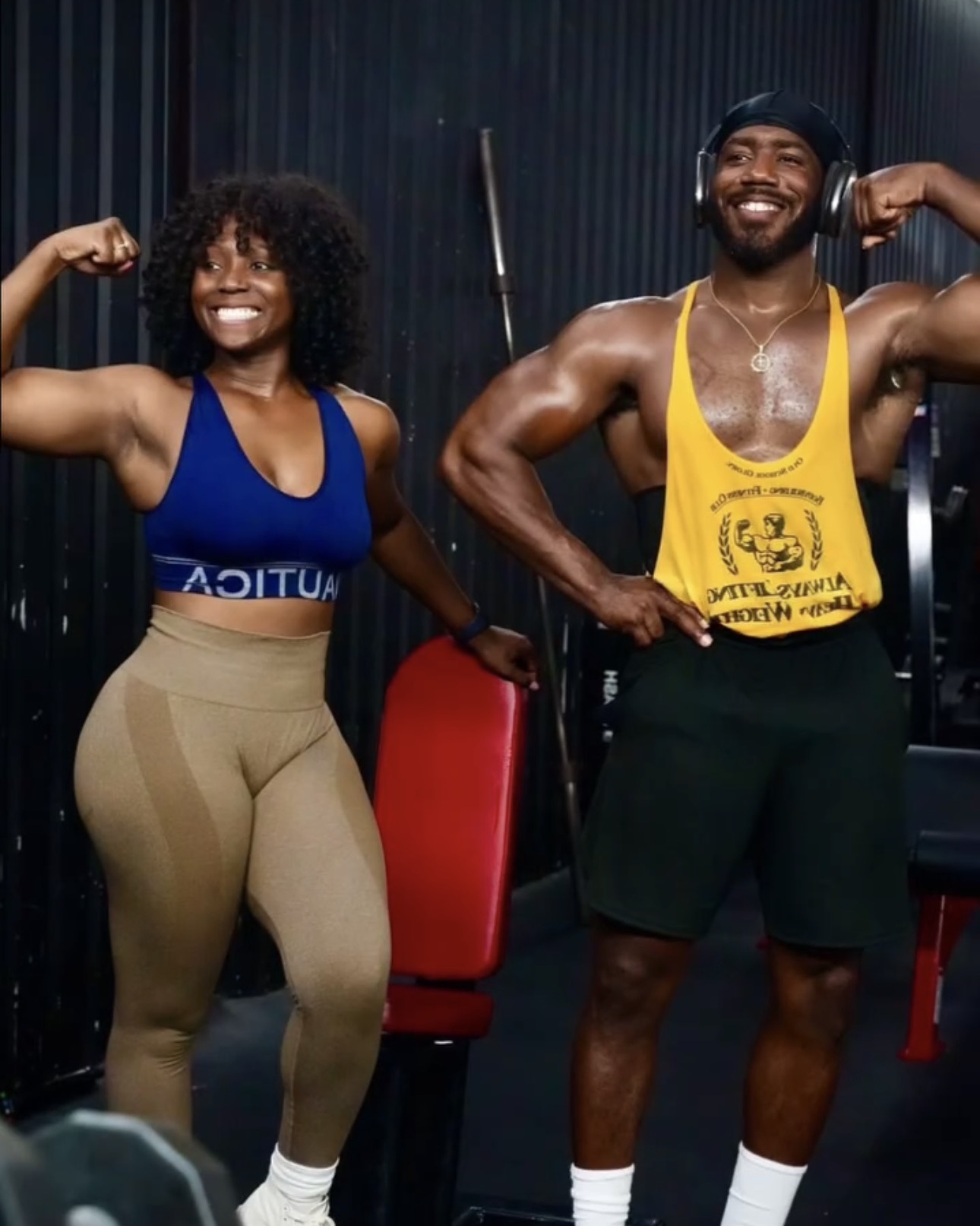 Two members celebrating their strength together at The Uplift